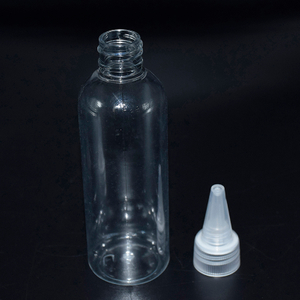Botella de loción redonda con tapa de punta de boquilla larga